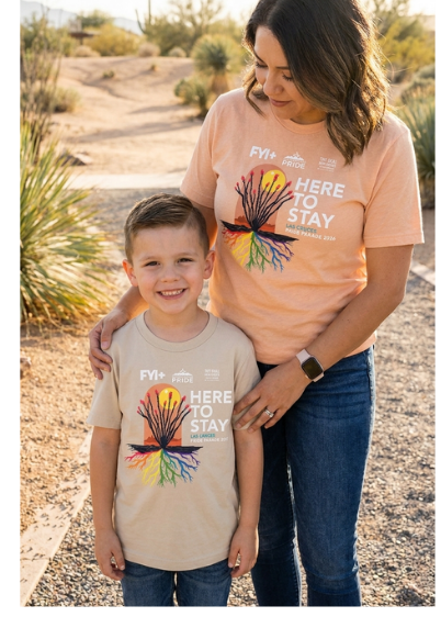 Parent and child wearing Here to Stay tees, including a youth size