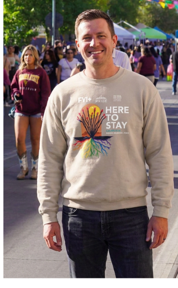 Person wearing the Here to Stay crewneck at the parade